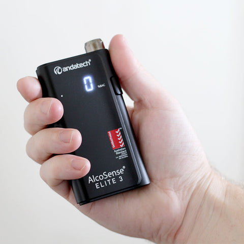 A man holding Andatech AlcoSense Elite 3 Personal Breathalyser