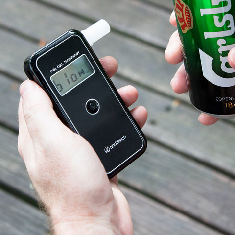 A man holding the Andatech AlcoSense Stealth Personal Breathalyser