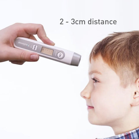 Taking a child's forehead temperature measurement with the MedSense Compact Digital Infrared Thermometer for Forehead and Objects