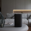 Ionmax Selah ION360 Portable UV HEPA Air Purifier on a coffee table in the living room
