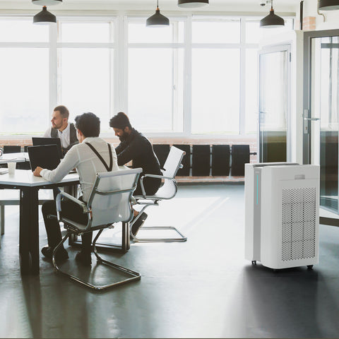 Ionmax+ Aire high-performance HEPA air purifier in office meeting room