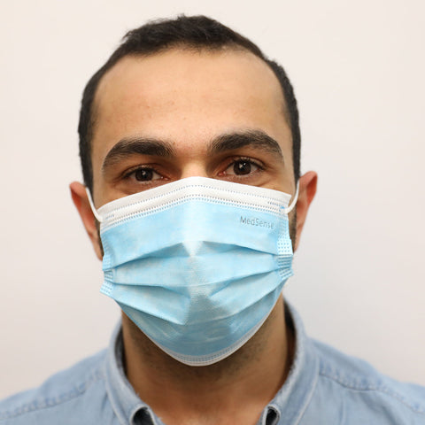 A man wearing the MedSense Disposable Face Masks with Ear Loops (FMR5) front angle