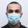 A man wearing the MedSense Disposable Face Masks with Ear Loops (FM1)