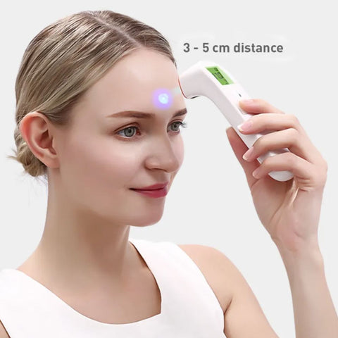 Woman testing her own forehead with the MedSense Digital Infrared Thermometer