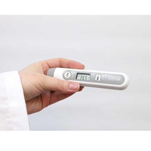 A doctor holding the MedSense Compact Digital Infrared Thermometer for Forehead and Objects